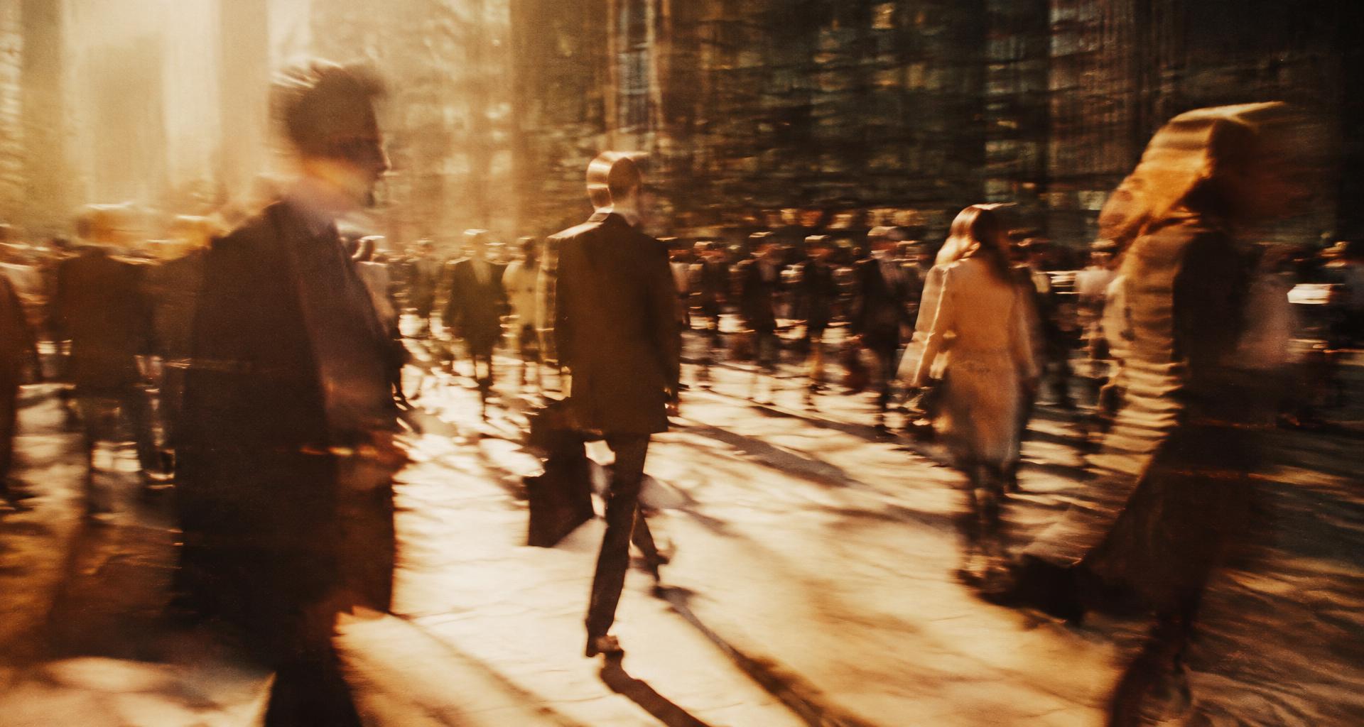 A team in motion through a sunlit city